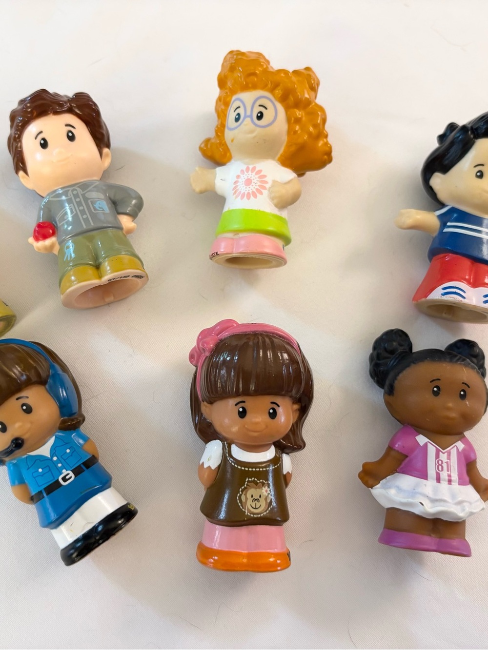 Fisher-Price Little People Brown-Haired Girl Figure with Pink & Orange Accents